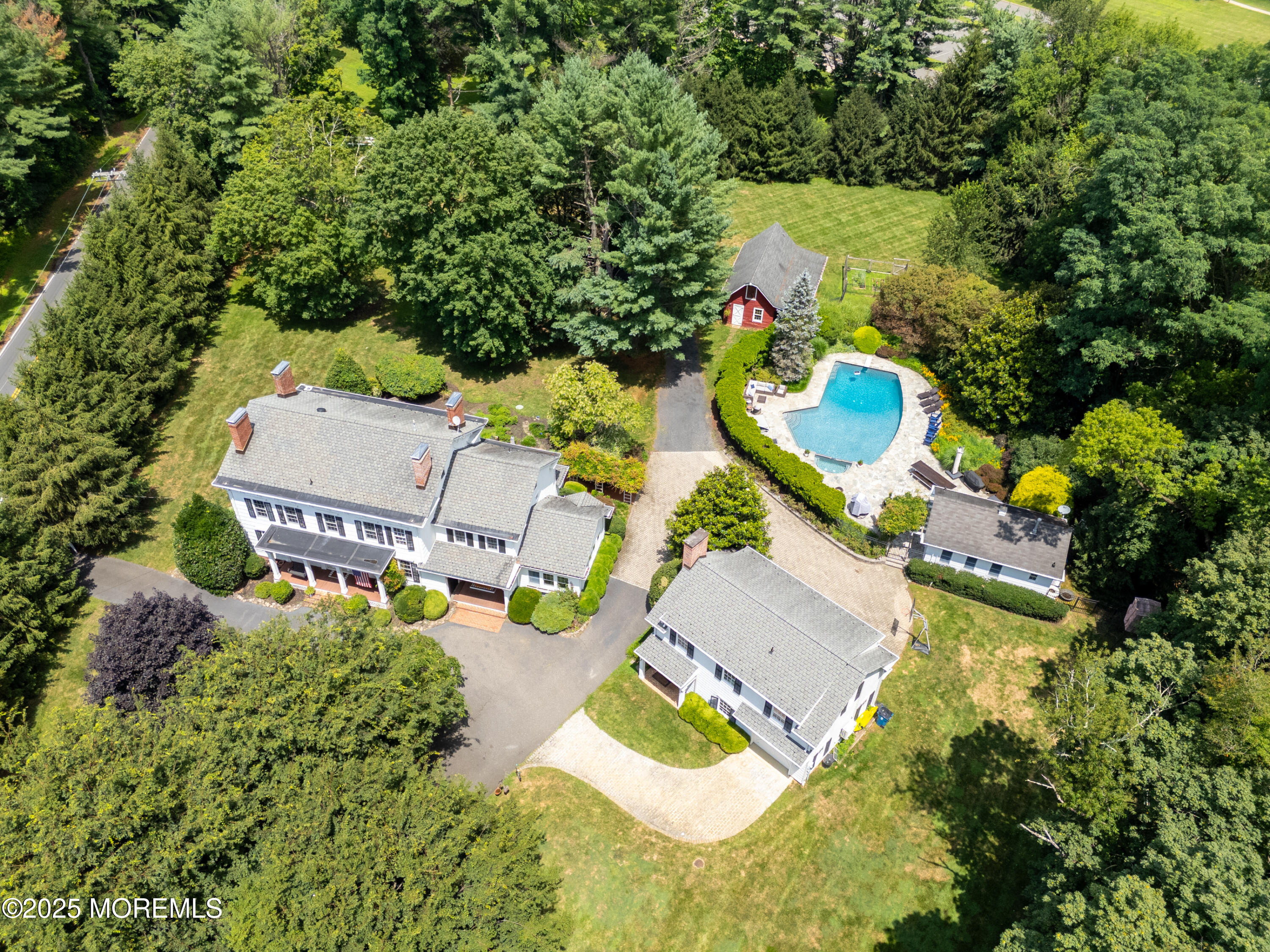 60 Conover Road Colts Neck, NJ 07722 - Photo 51 of 56 an aerial view of residential house with outdoor space and swimming pool