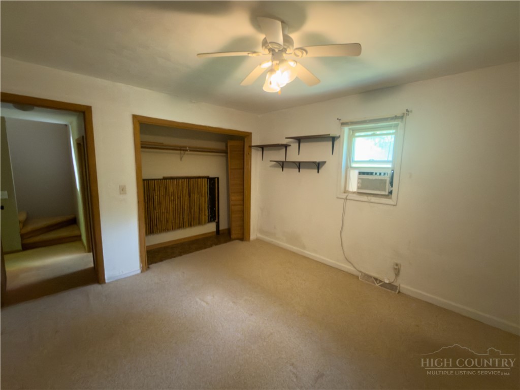 1205 Bamboo Road Boone, NC 28607 - Photo 7 of 17 a view of empty room with a fireplace