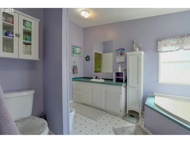 a kitchen with a refrigerator and a sink