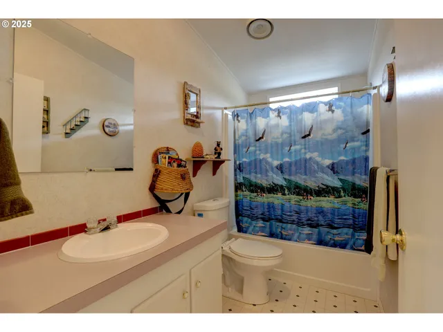 a view of a bathroom from a hallway