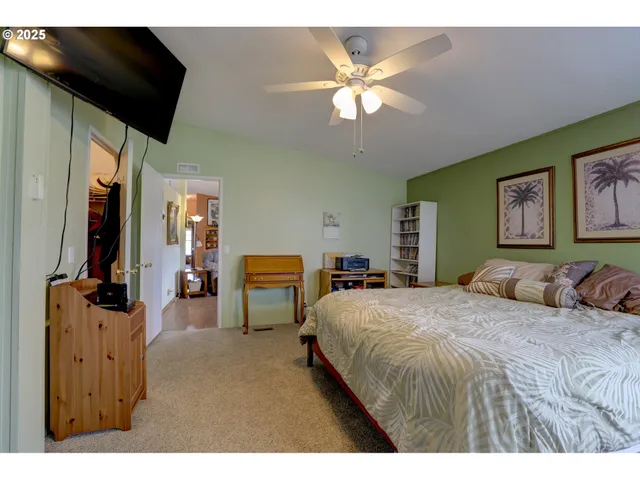 a balcony with wooden floor table and chairs