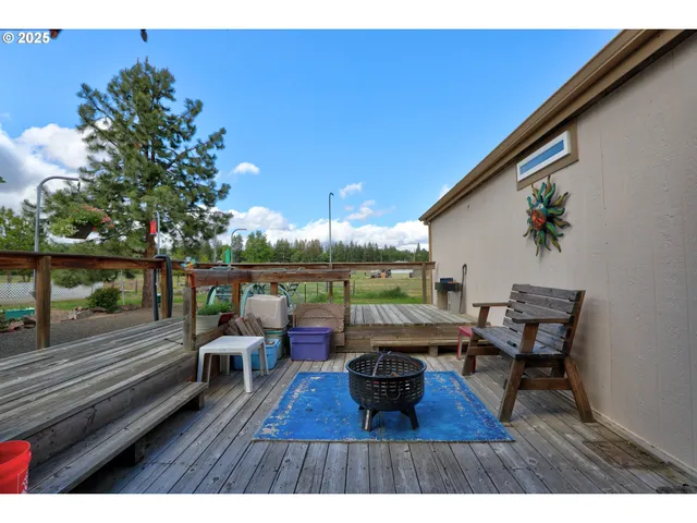 a house view with a seating space and garden