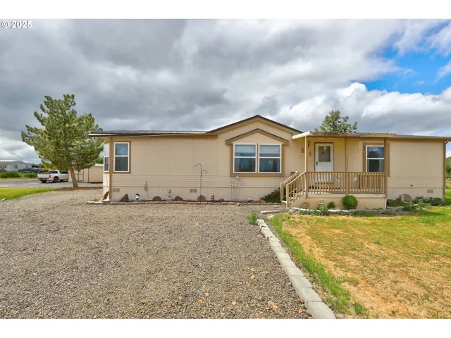 a view of a swimming pool with a yard
