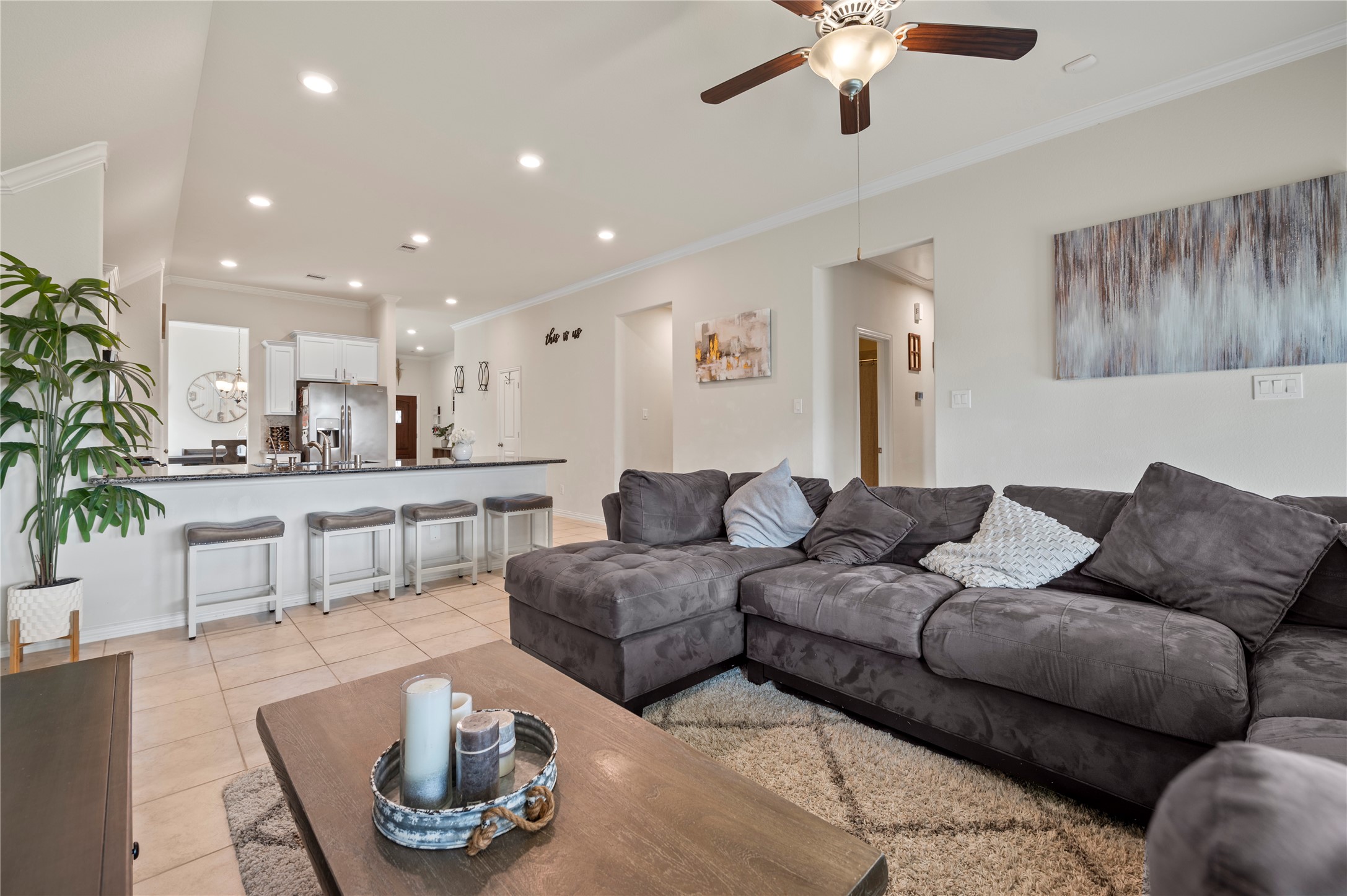 13726 Madera Bend Lane Rosharon, TX 77583 - Photo 15 of 34 a living room with furniture and a chandelier