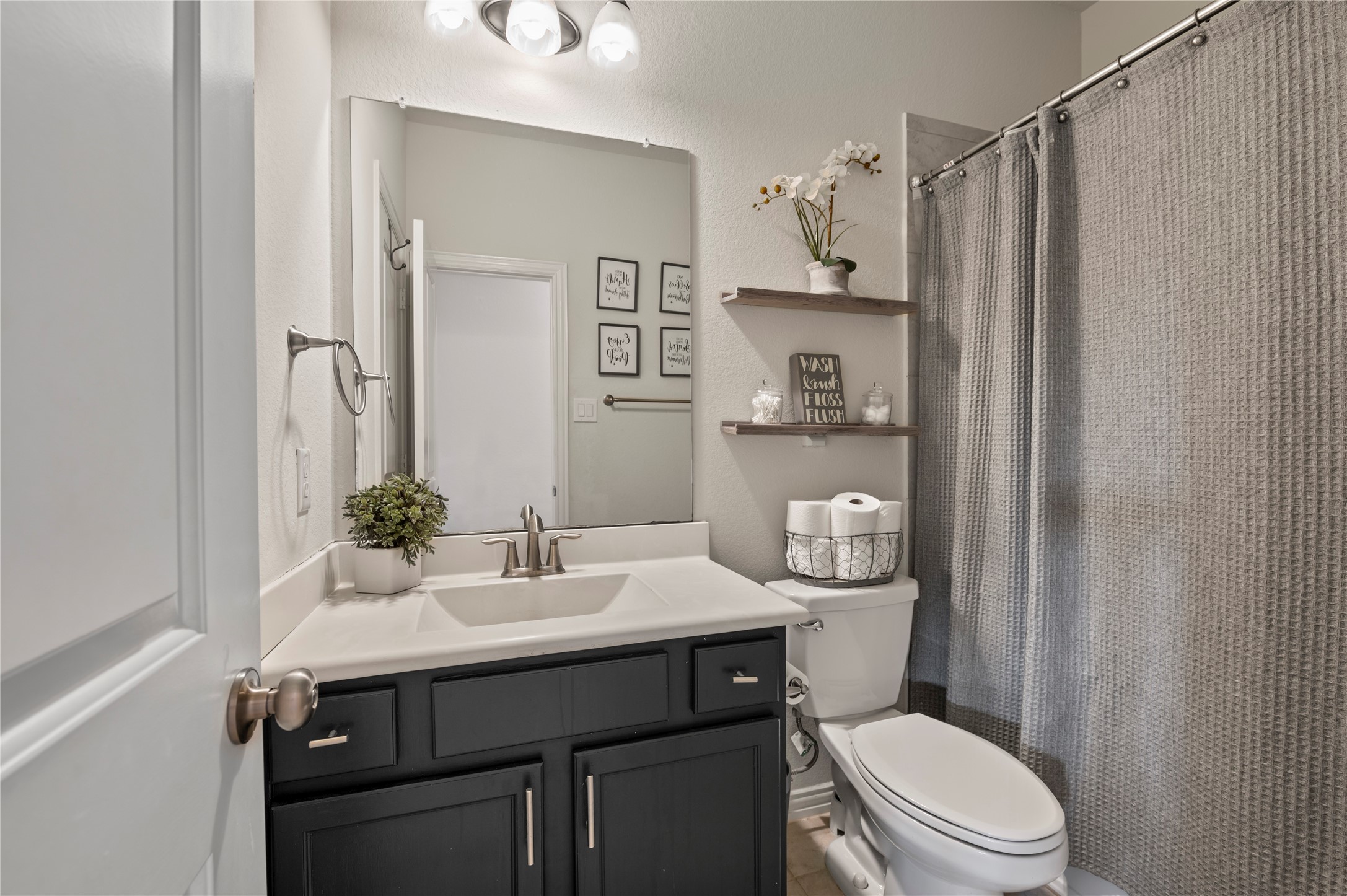 13726 Madera Bend Lane Rosharon, TX 77583 - Photo 16 of 34 a bathroom with a sink toilet and shower