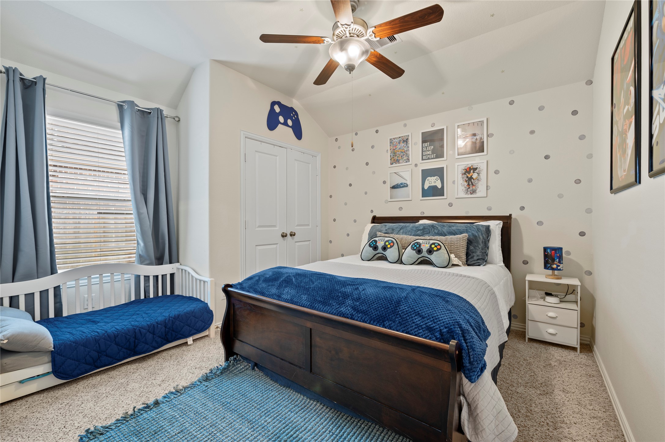 13726 Madera Bend Lane Rosharon, TX 77583 - Photo 17 of 34 a bedroom with a bed and a chandelier