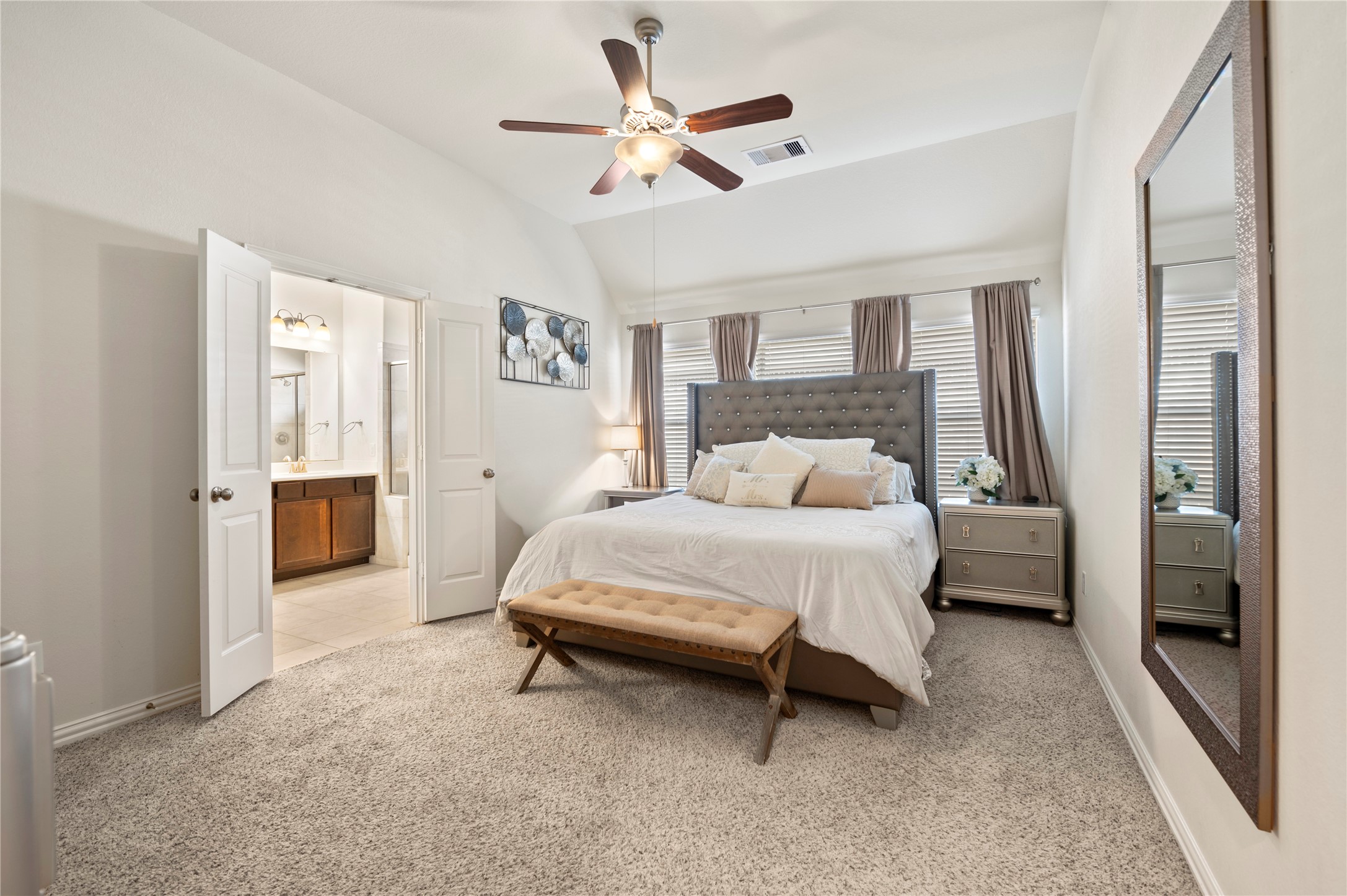 13726 Madera Bend Lane Rosharon, TX 77583 - Photo 21 of 34 a bedroom with a bed and a chandelier