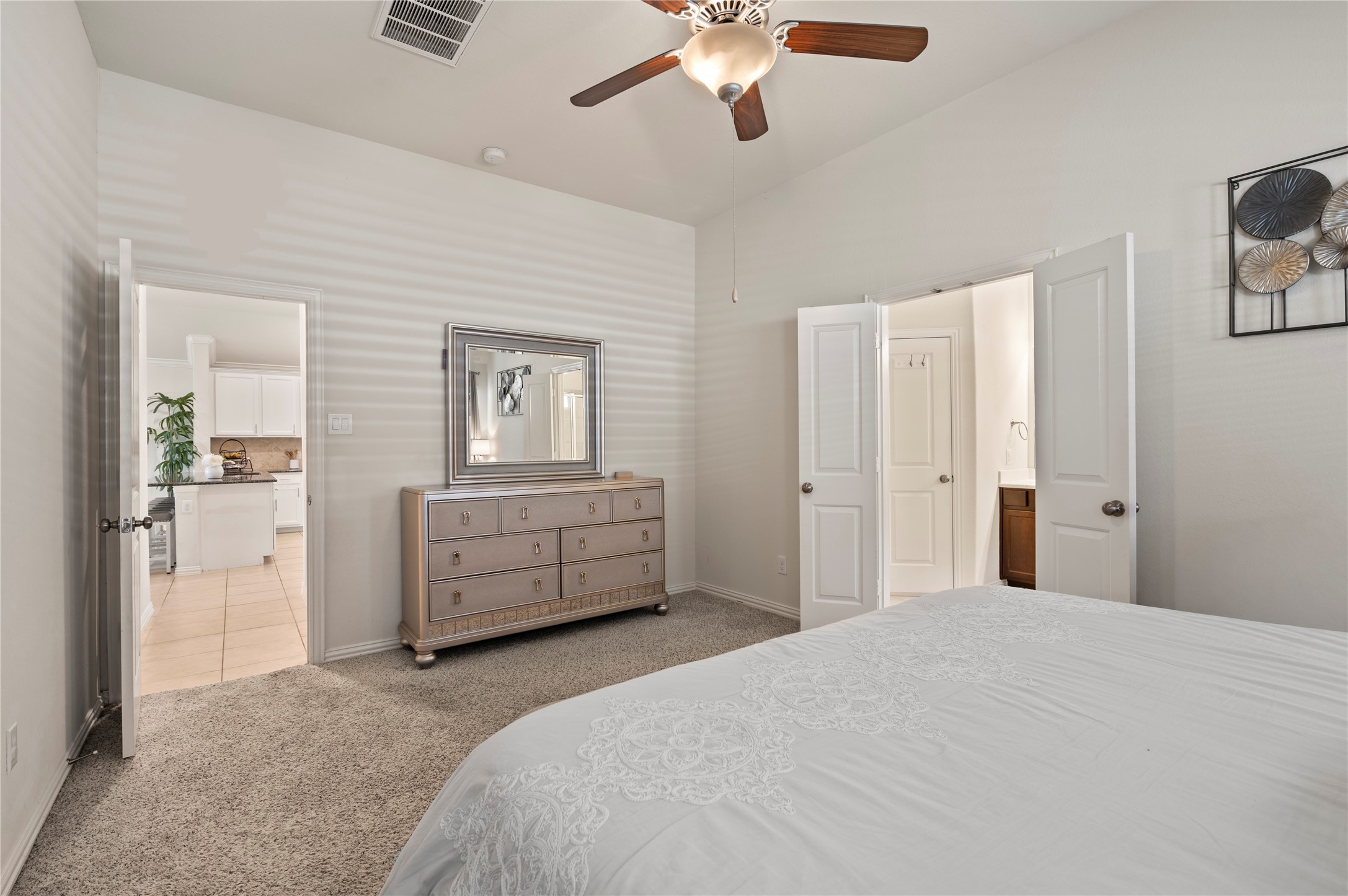13726 Madera Bend Lane Rosharon, TX 77583 - Photo 22 of 34 a bedroom with a bed and a chandelier
