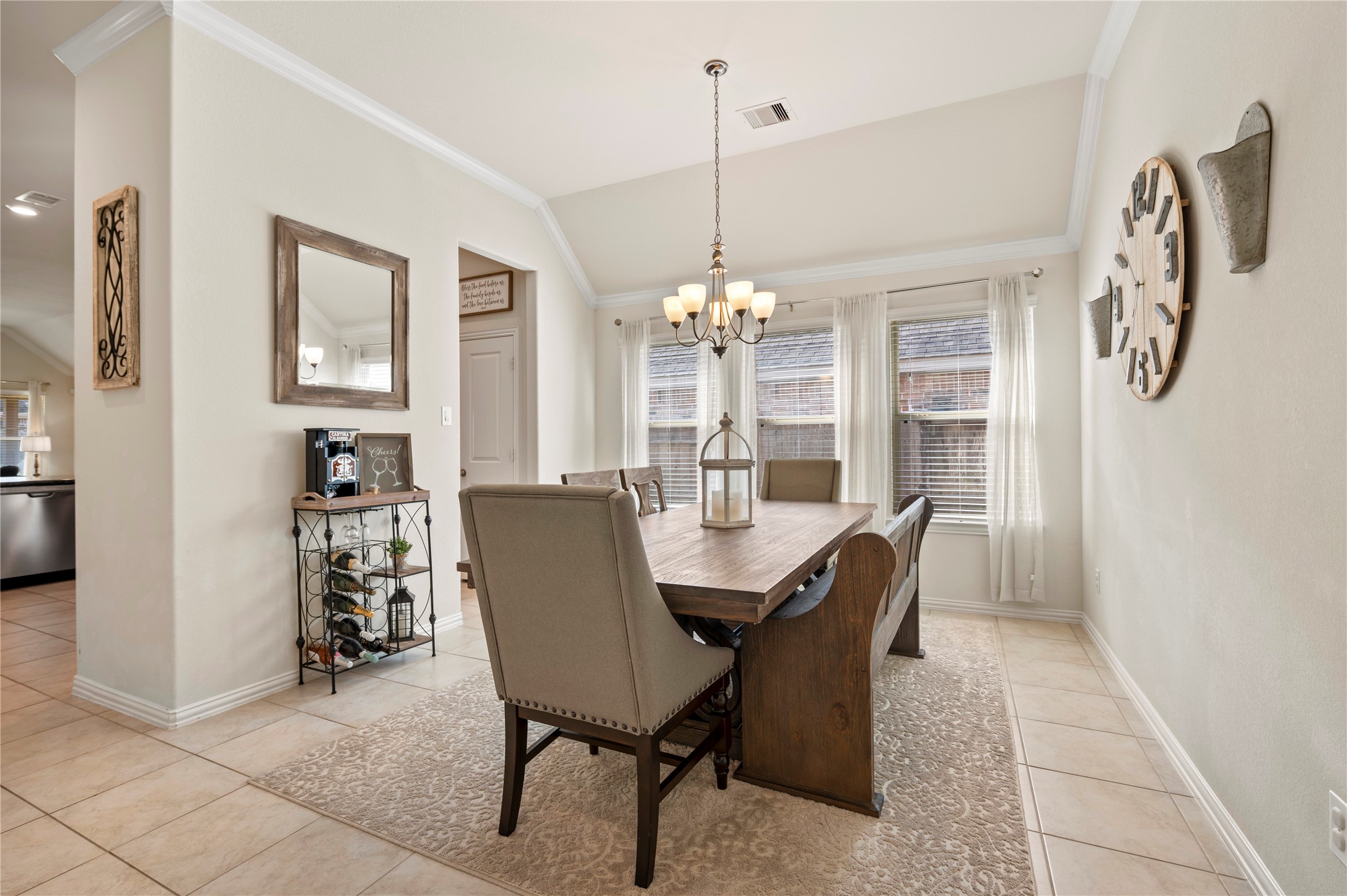 13726 Madera Bend Lane Rosharon, TX 77583 - Photo 8 of 34 a view of a dining room with furniture and chandelier