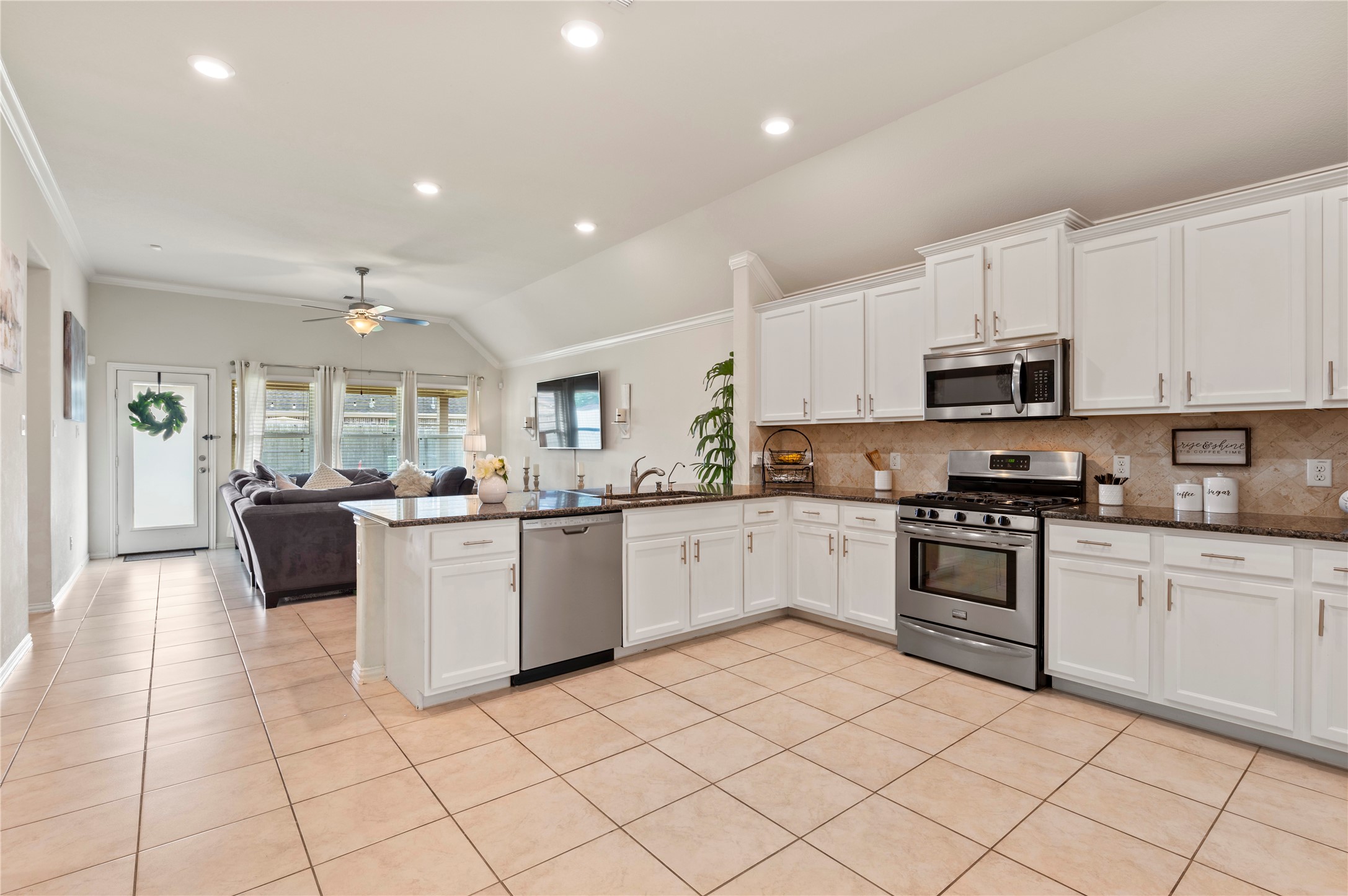 13726 Madera Bend Lane Rosharon, TX 77583 - Photo 10 of 34 a kitchen with granite countertop cabinets and steel stainless steel appliances