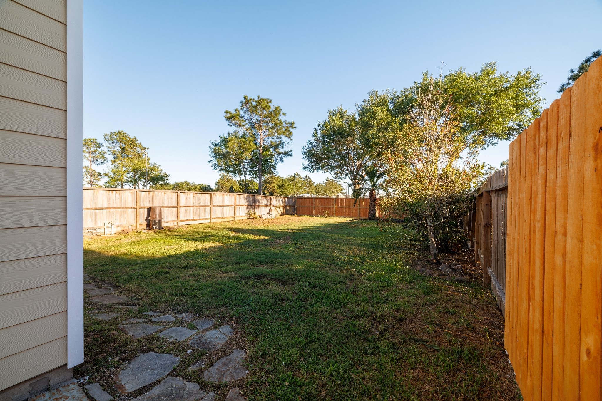 8318 Tartan Court Rosharon, TX 77583 - Photo 23 of 31 Large, well-maintained fenced backyard ideal for privacy and outdoor activities.