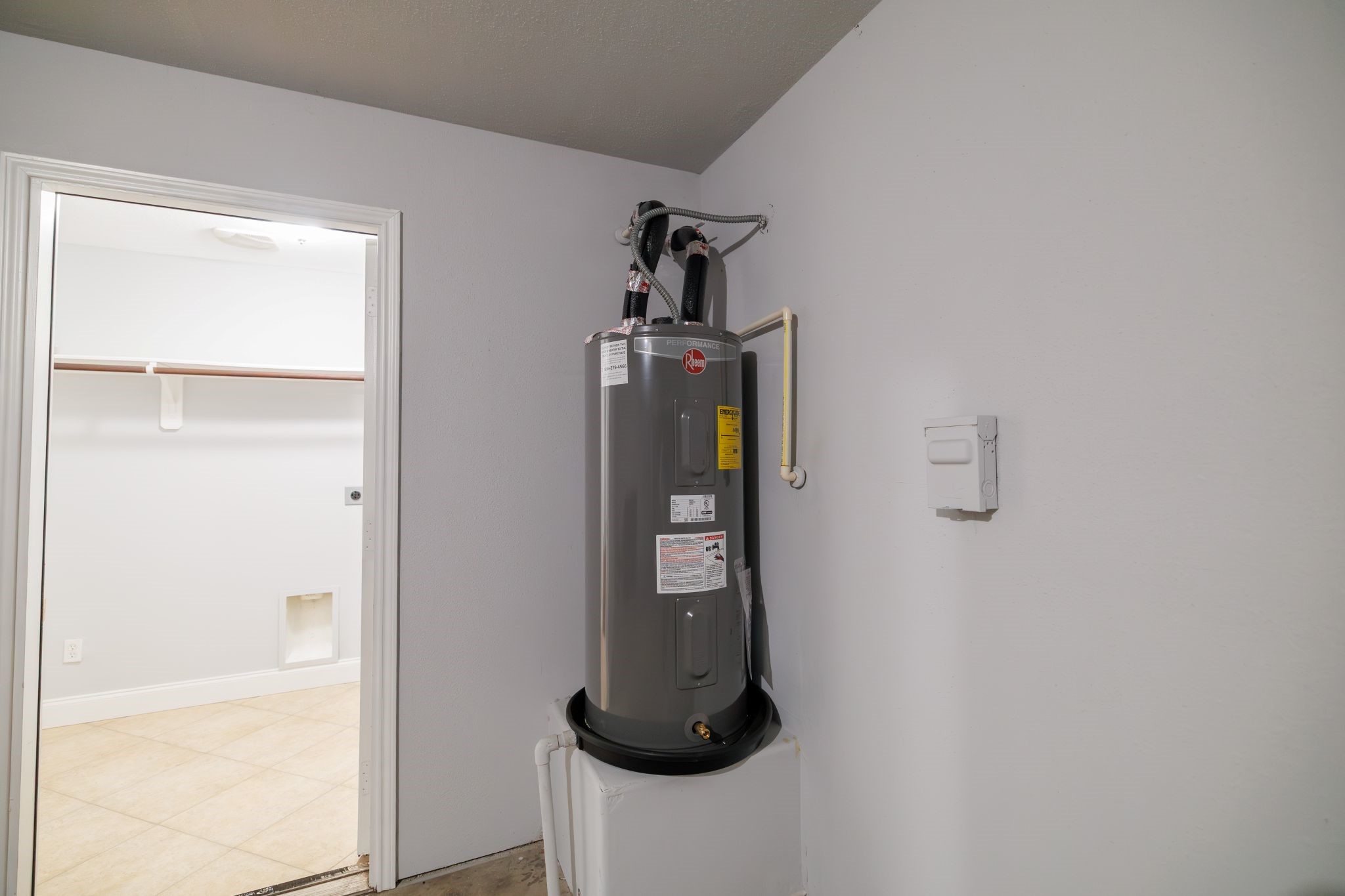 8318 Tartan Court Rosharon, TX 77583 - Photo 26 of 31 New water heater located in the garage. Access to the utility room.