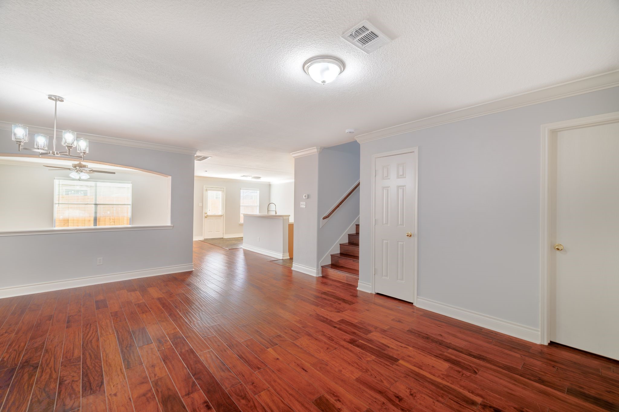 8318 Tartan Court Rosharon, TX 77583 - Photo 5 of 31 Rich hardwood floors and elegant crown molding enhance the interior, fresh paint on both walls and ceilings.