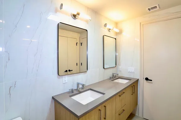 a bathroom with a bathtub and shower