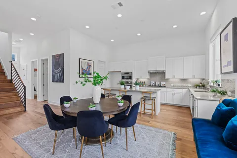 a view of a workspace with a table and chair in a room