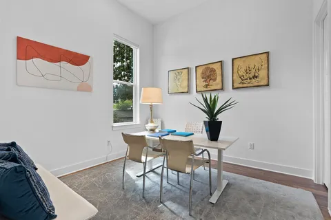 a bedroom with a bed and a table