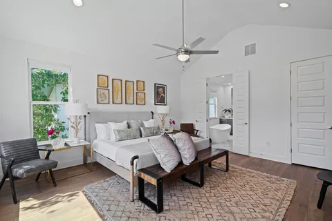a bedroom with furniture and a potted plant