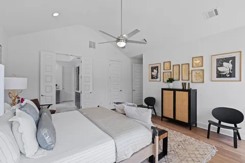 a bathroom with a sink double vanity granite tub shower and a mirror