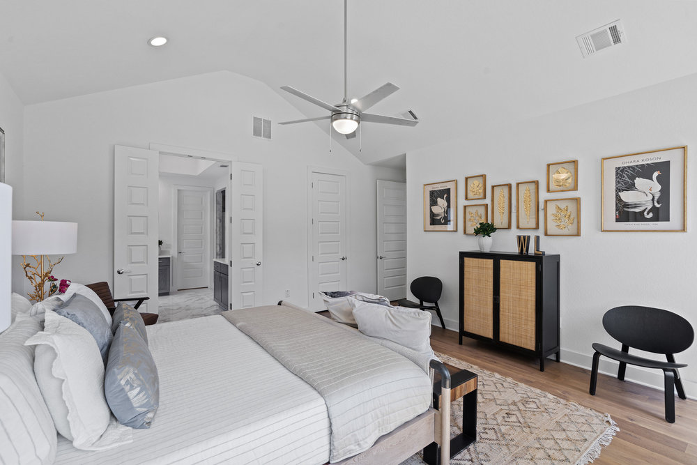 5324 Agatha Circle Austin, TX 78724 - Photo 19 of 34 a bedroom with a bed and a chair