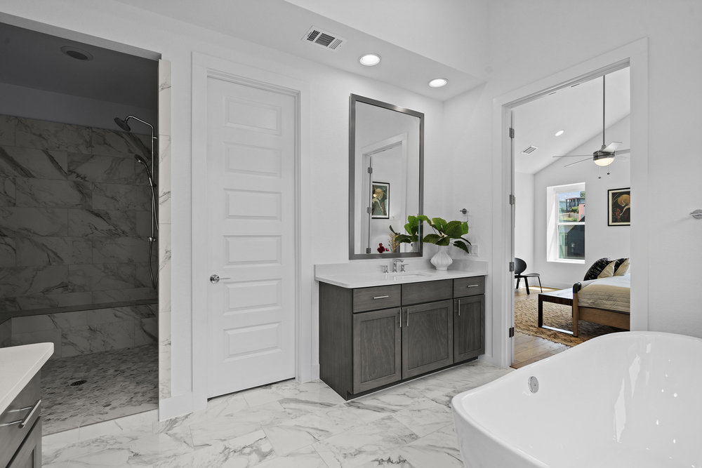 5324 Agatha Circle Austin, TX 78724 - Photo 21 of 34 a spacious bathroom with a double vanity sink and a mirror