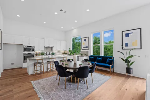 a view of a dining room with furniture window and wooden floor
