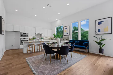 a view of a dining room with furniture window and wooden floor