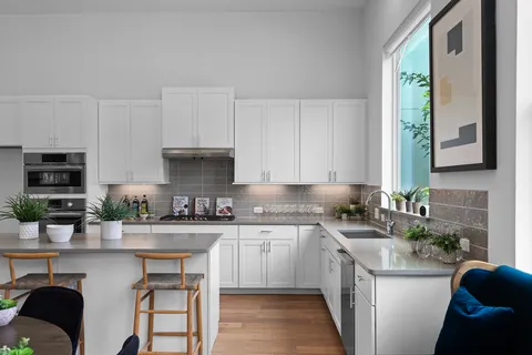 a living room with furniture and a rug