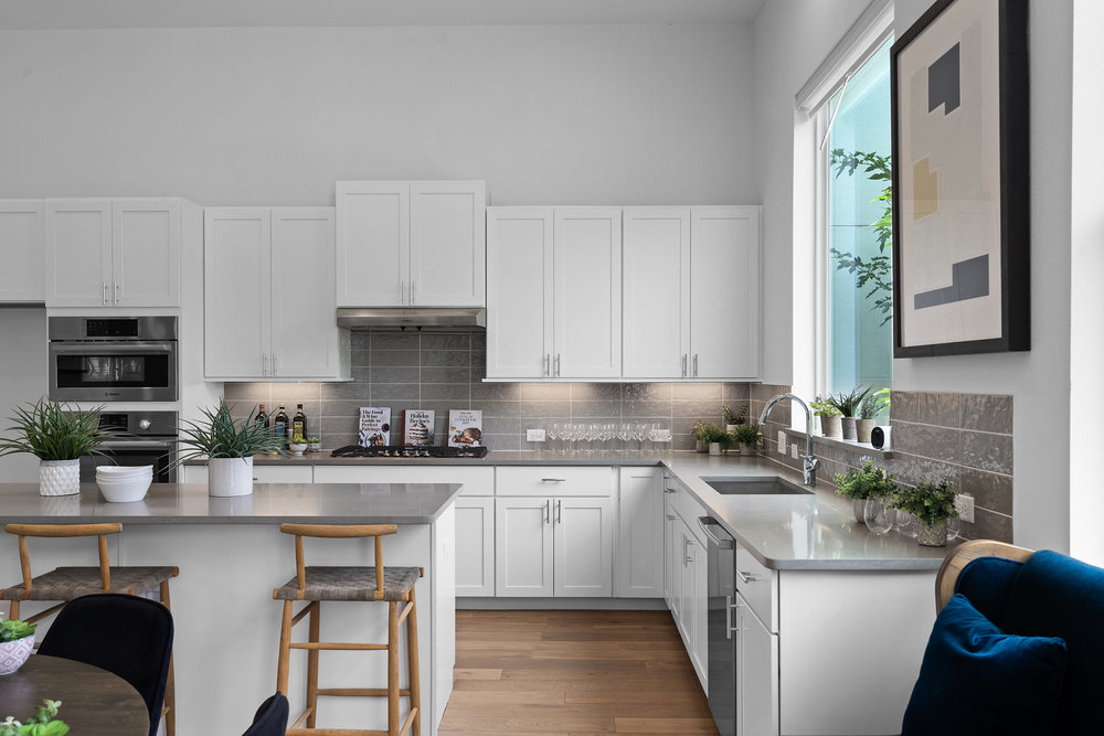 5324 Agatha Circle Austin, TX 78724 - Photo 9 of 34 a kitchen with stainless steel appliances a stove a sink a microwave a refrigerator and cabinets
