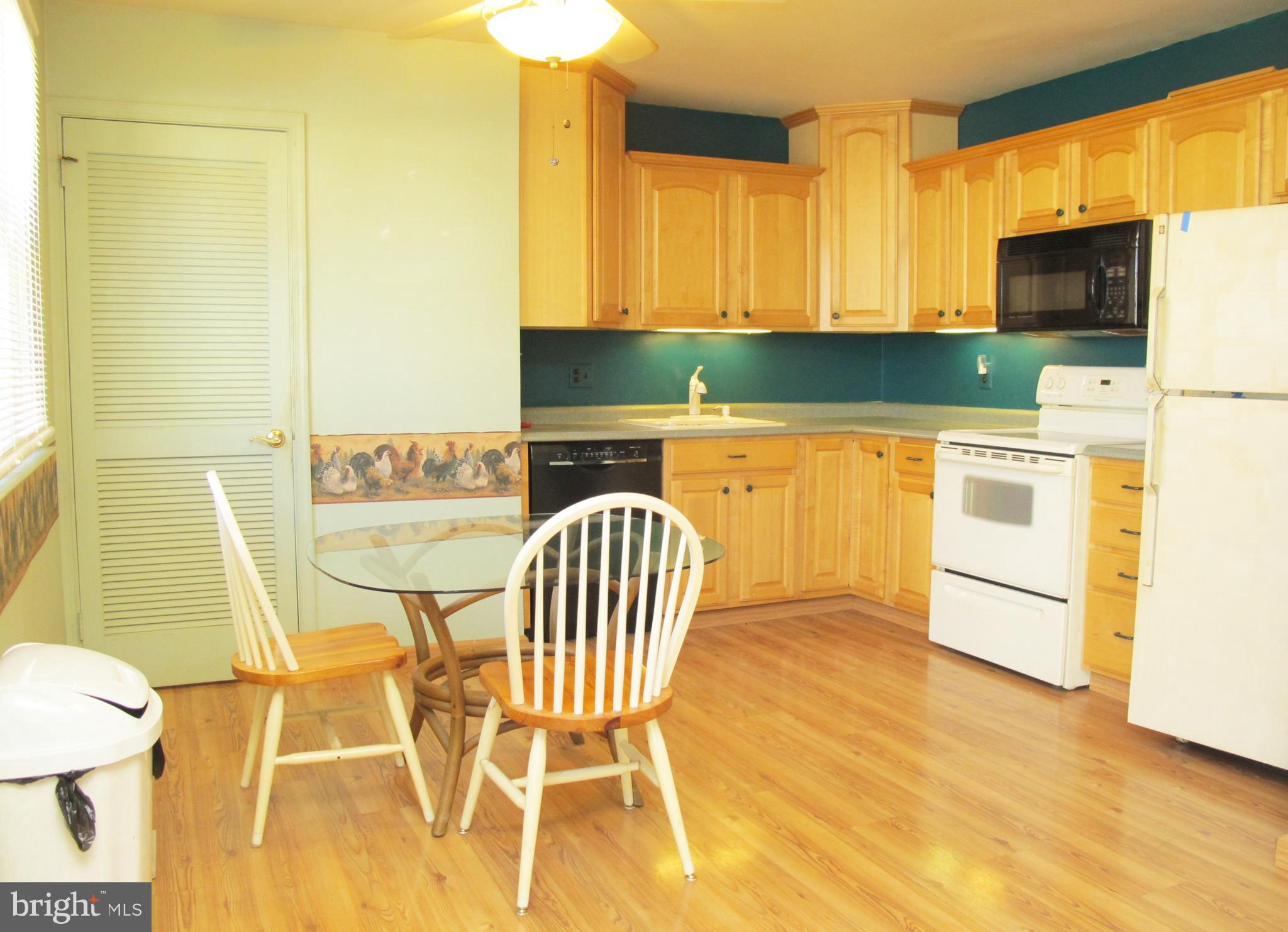 206 Paddock Way Delran, NJ 08075 - Photo 10 of 33 a kitchen with stainless steel appliances granite countertop a sink a stove a microwave a counter top space and cabinets
