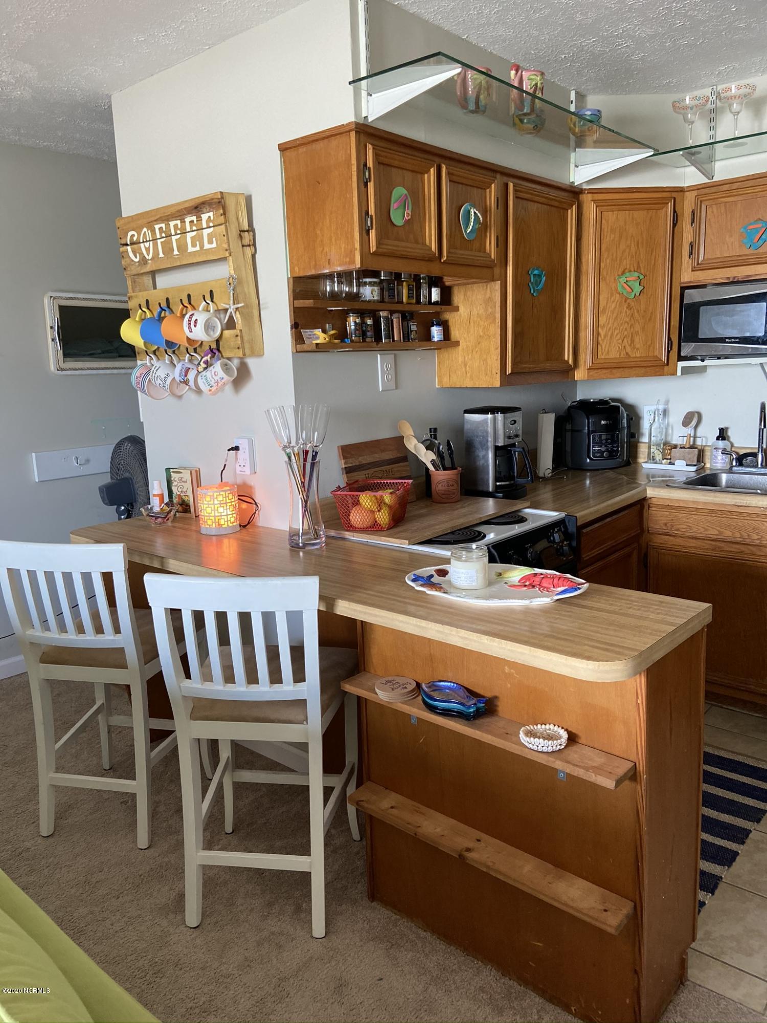 2174 New River Inlet Road, Unit 284 North Topsail Beach, NC 28460 - Photo 7 of 13 Kitchen Dining