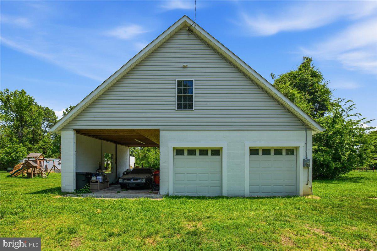 16146 Thomas Road Piney Point, MD 20674 - Photo 60 of 70 a view of front of house with a yard
