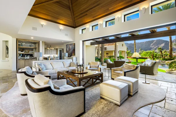 a room with furniture pool table and flat screen tv