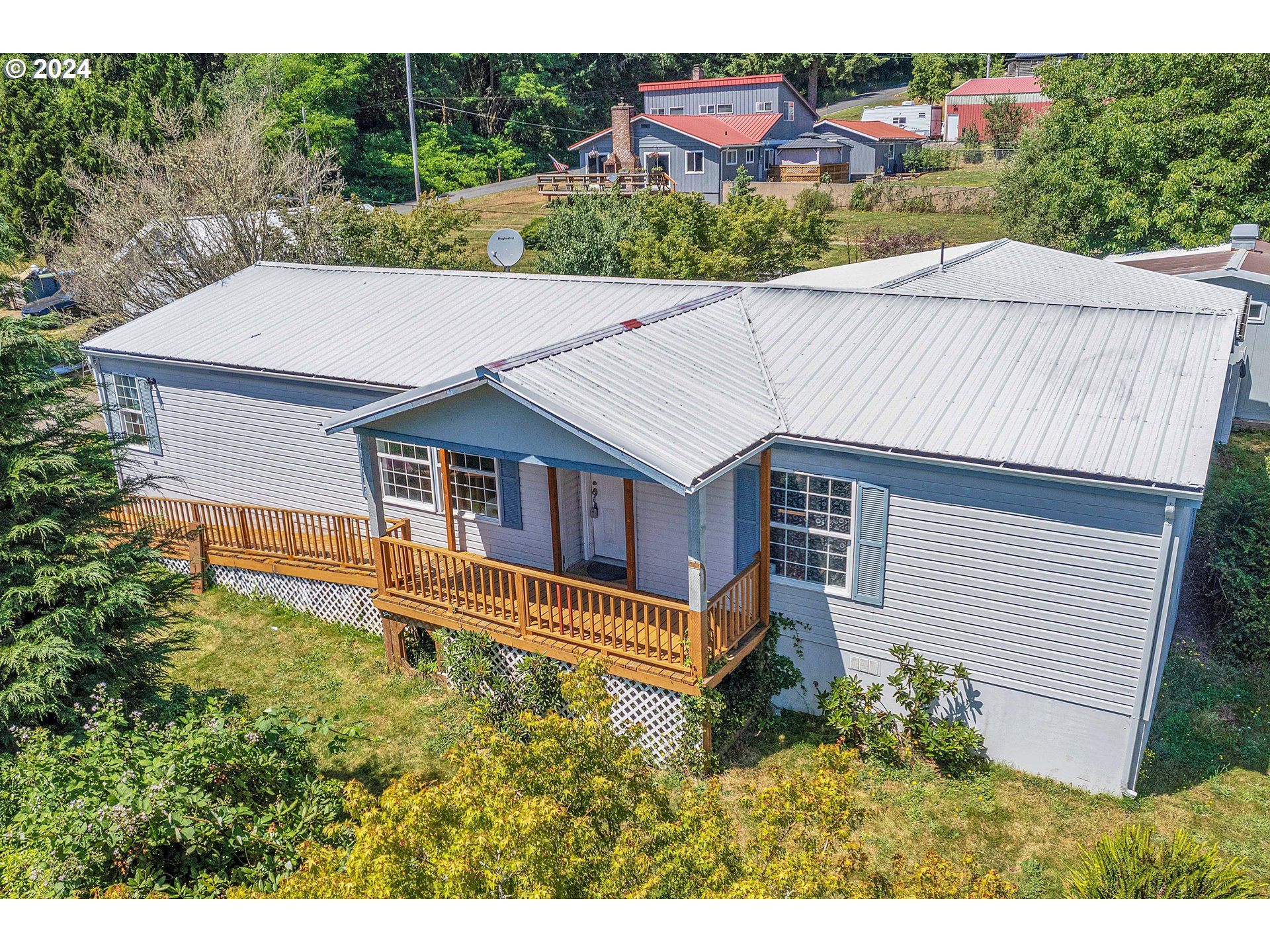 76066 Atkins Road Rainier, OR 97048 - Photo 1 of 43 a aerial view of a house with a yard and potted plants