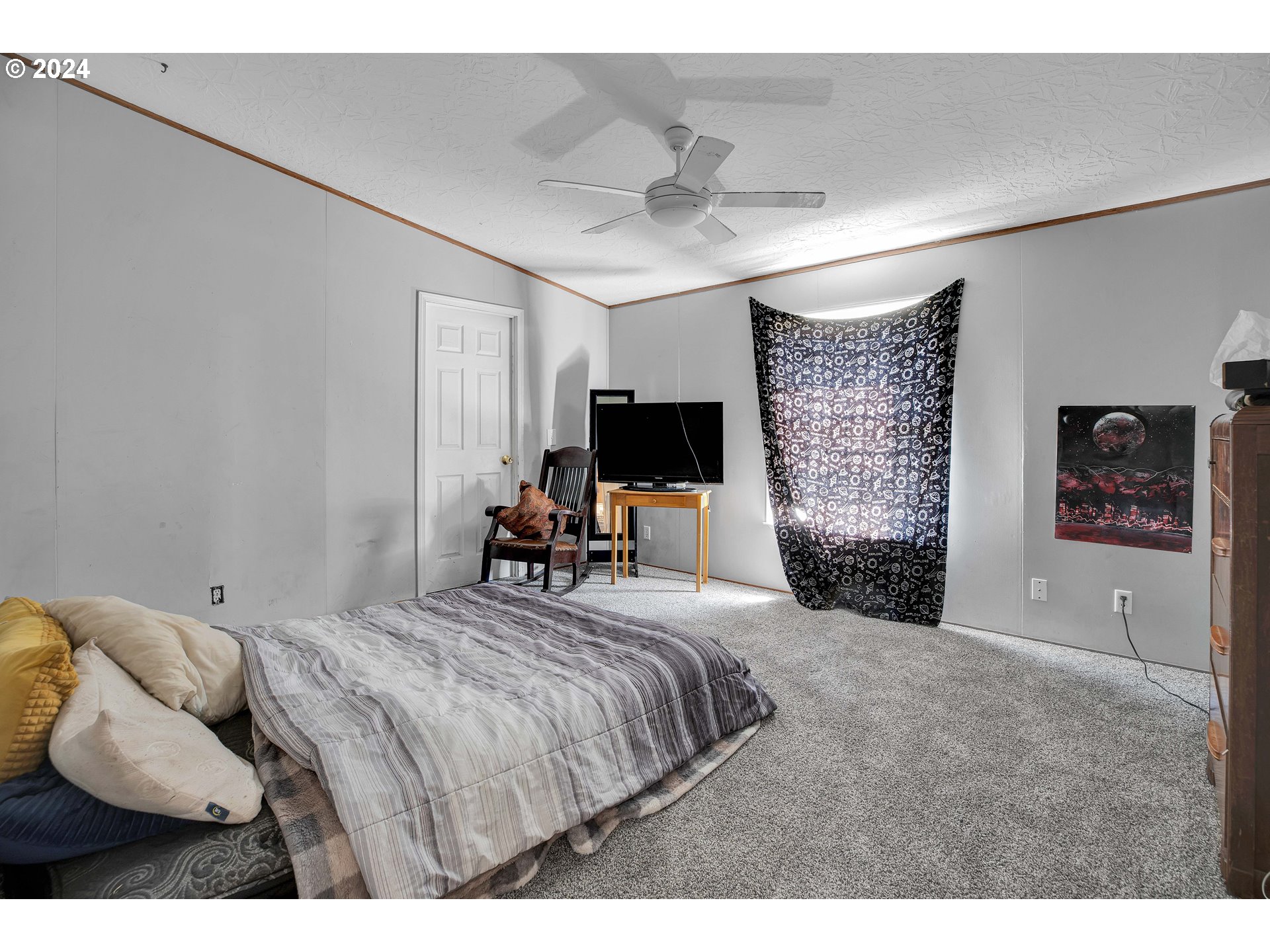 76066 Atkins Road Rainier, OR 97048 - Photo 18 of 43 a bedroom with a bed and flat screen tv