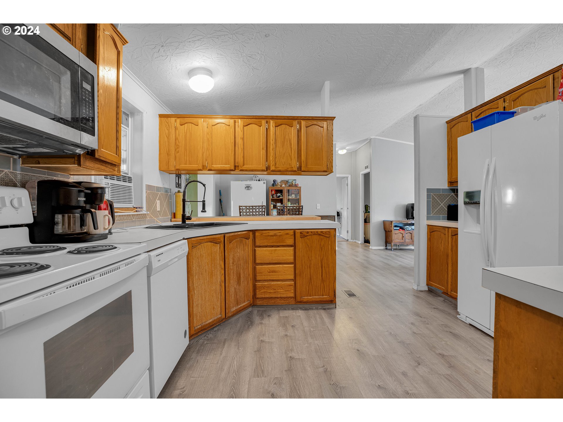 76066 Atkins Road Rainier, OR 97048 - Photo 9 of 43 a kitchen with a sink cabinets and window