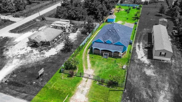 a aerial view of a house with a yard