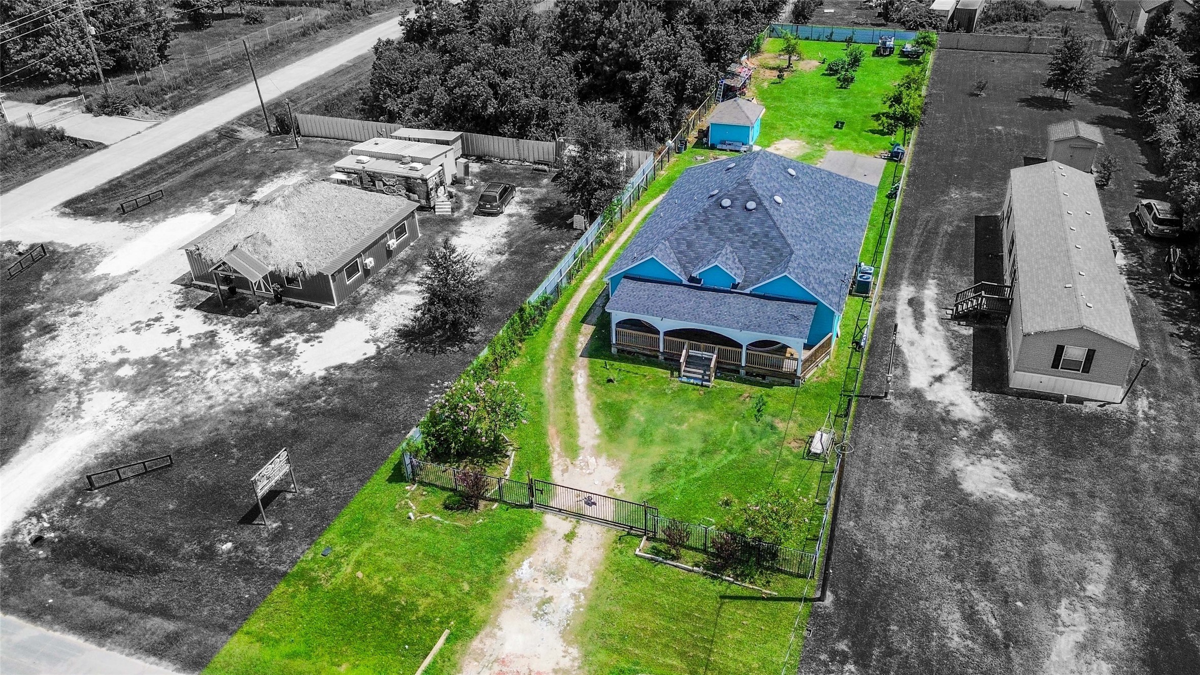 a aerial view of a house with a yard