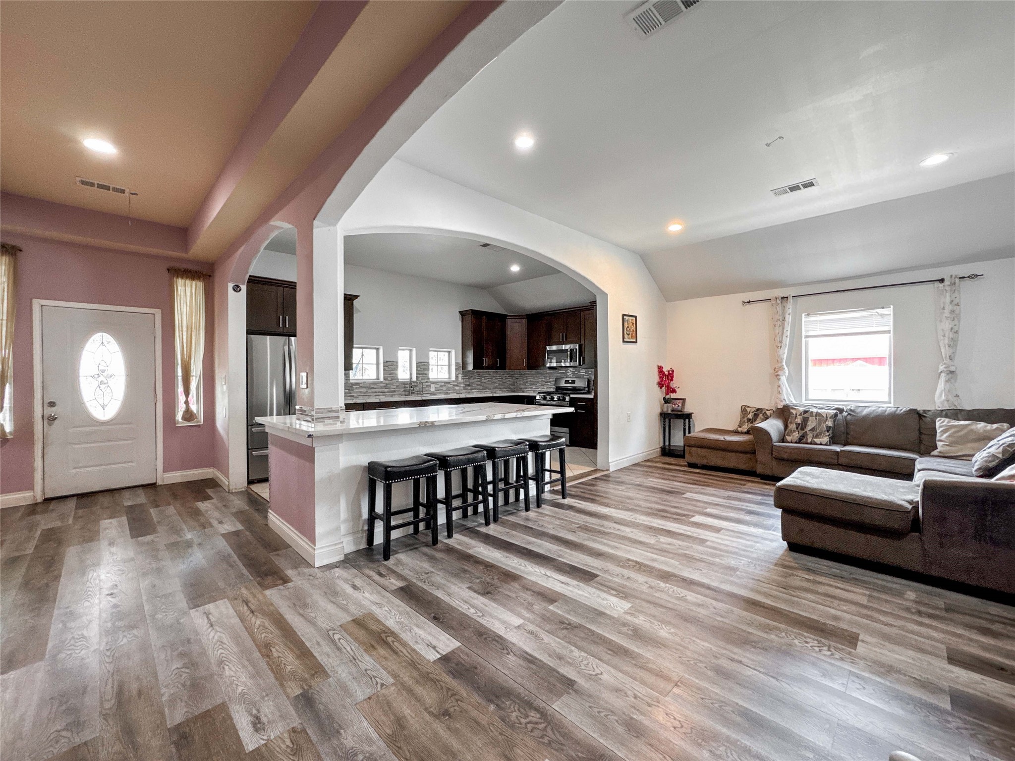 1060 County Road 5021 Cleveland, TX 77327 - Photo 11 of 34 a living room with furniture and a wooden floor