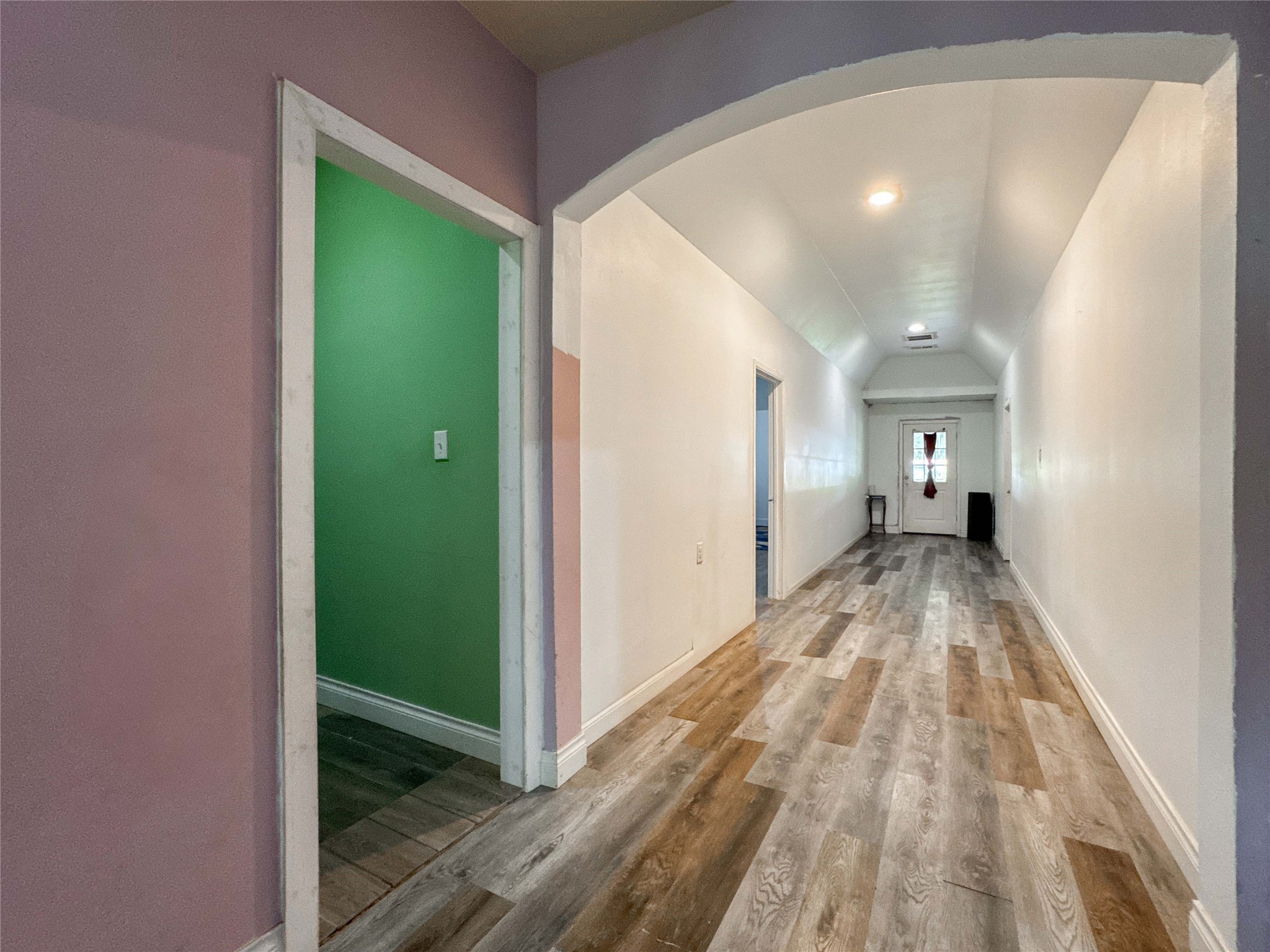 1060 County Road 5021 Cleveland, TX 77327 - Photo 12 of 34 a view of a hallway with wooden floor staircase and a living room