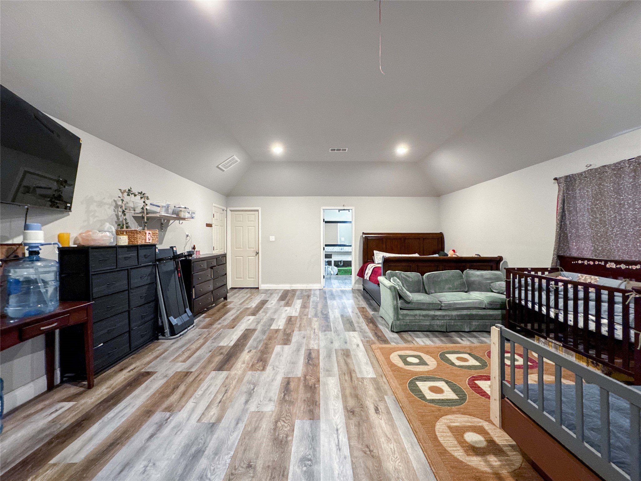 1060 County Road 5021 Cleveland, TX 77327 - Photo 14 of 34 a living room with furniture and a flat screen tv