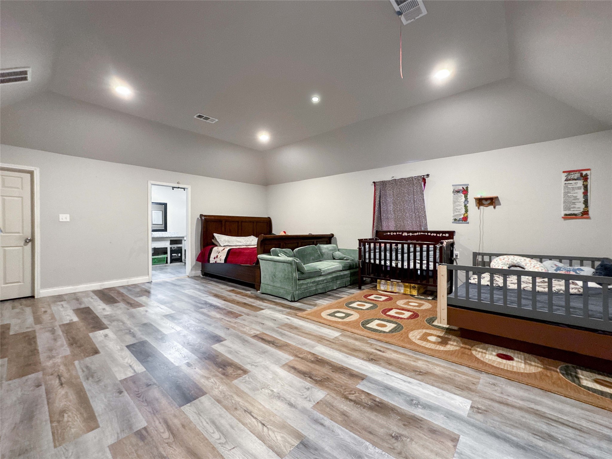 1060 County Road 5021 Cleveland, TX 77327 - Photo 15 of 34 a bedroom with double bunk beds and a dresser