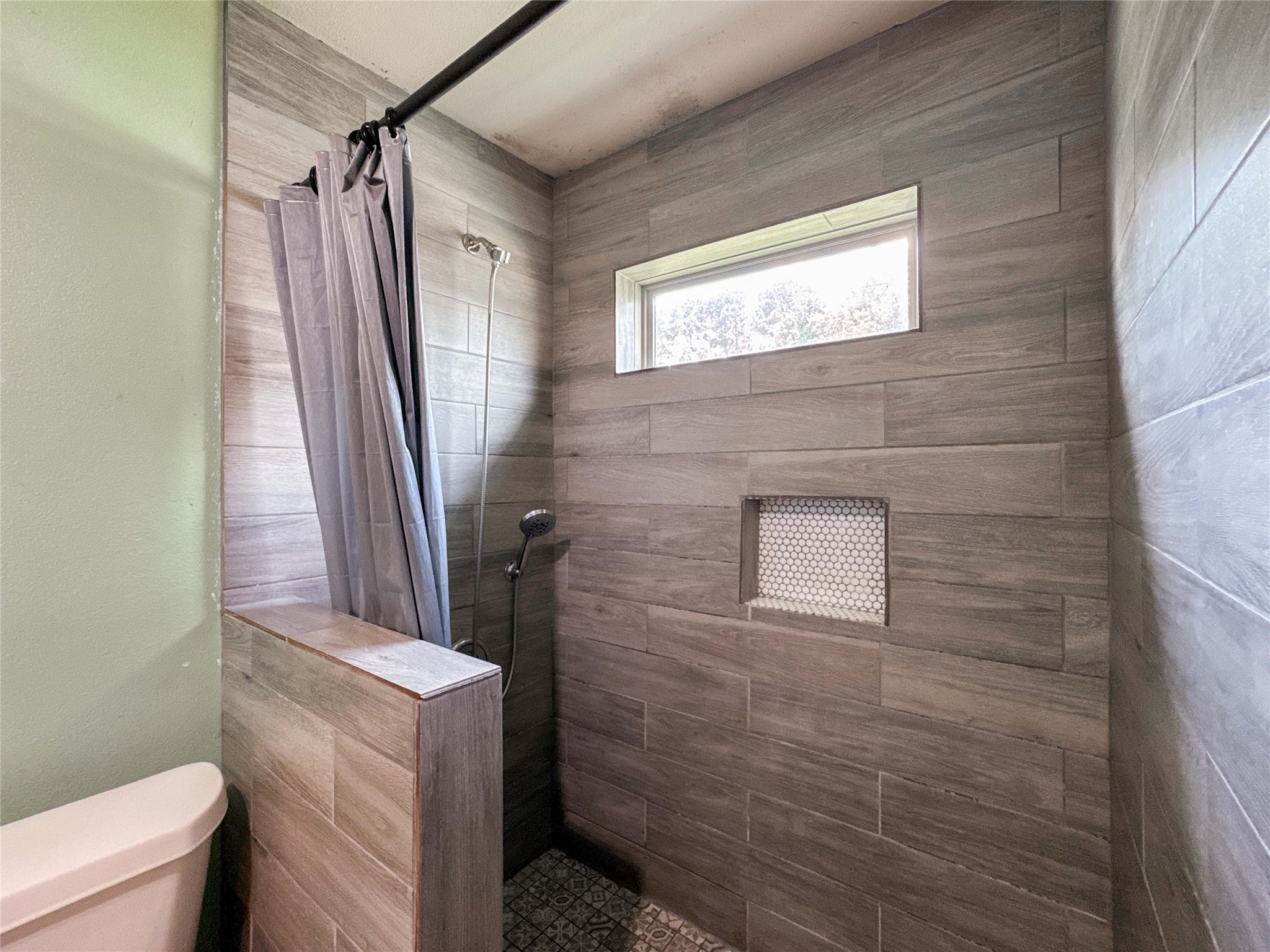 1060 County Road 5021 Cleveland, TX 77327 - Photo 17 of 34 a bathroom with a sink a toilet and a shower