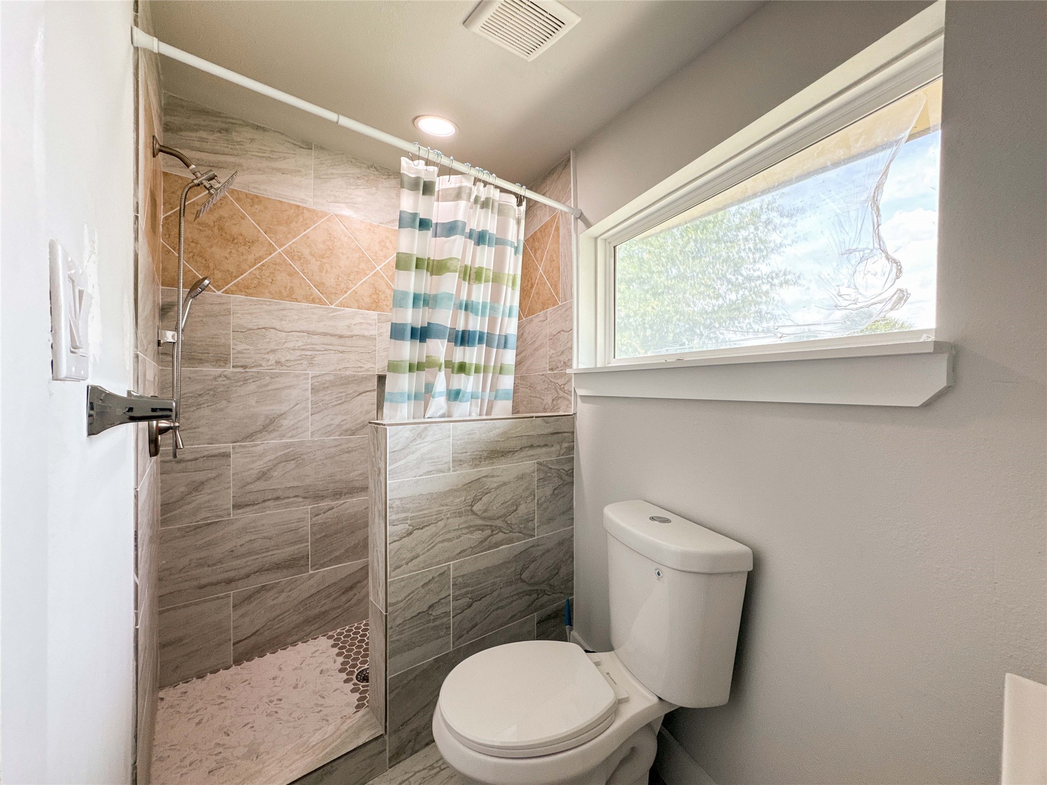 1060 County Road 5021 Cleveland, TX 77327 - Photo 21 of 34 a bathroom with a toilet and a shower