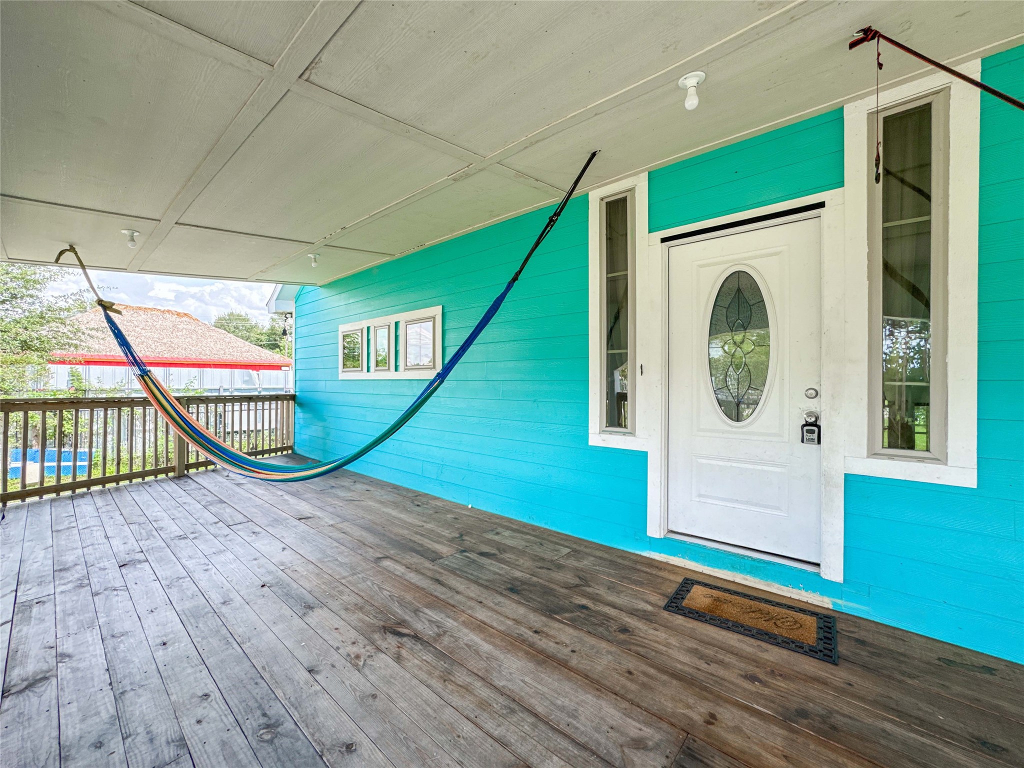 1060 County Road 5021 Cleveland, TX 77327 - Photo 32 of 34 an empty room with wooden floor and windows