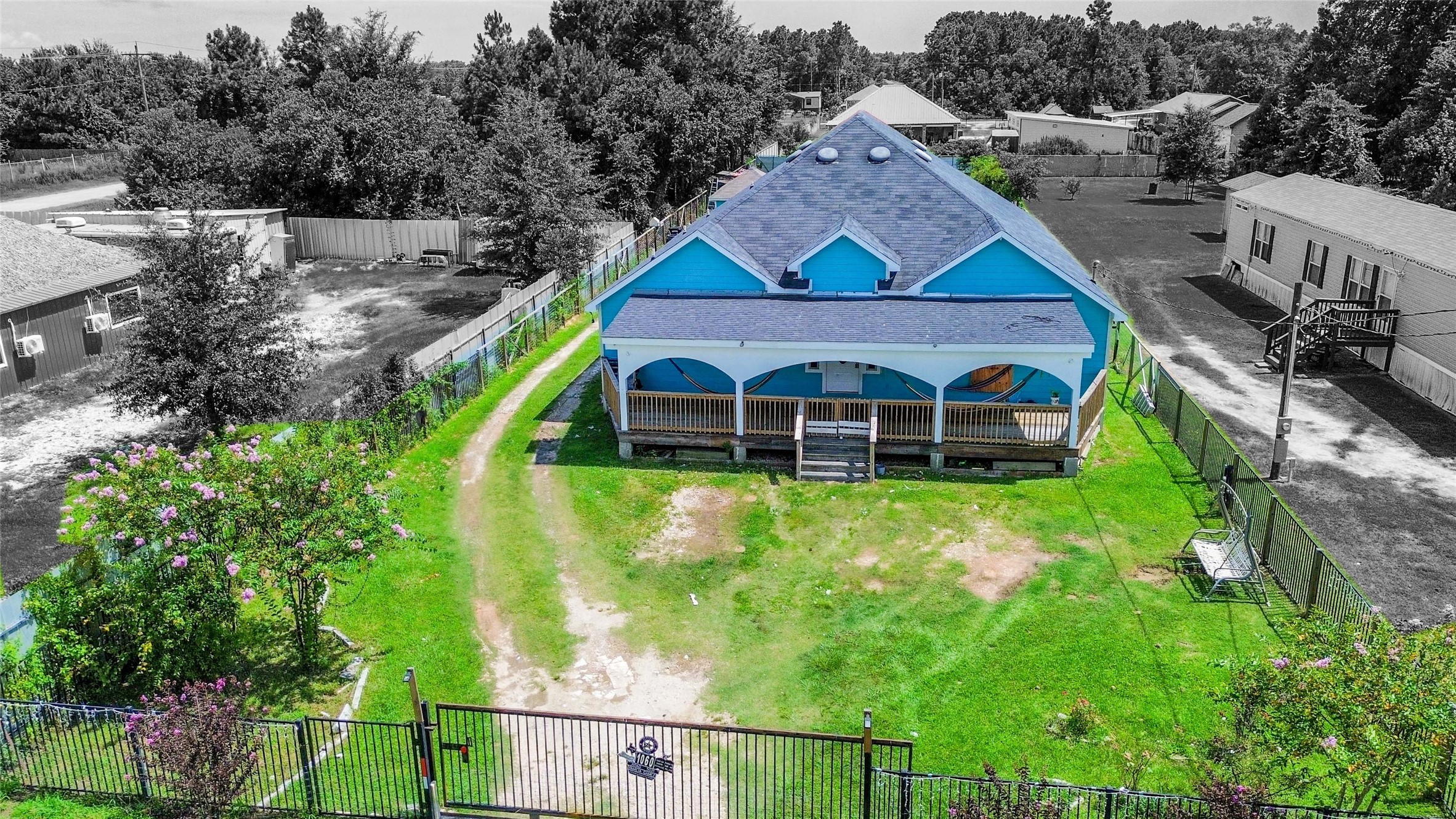 1060 County Road 5021 Cleveland, TX 77327 - Photo 33 of 34 a view of a big house with a yard
