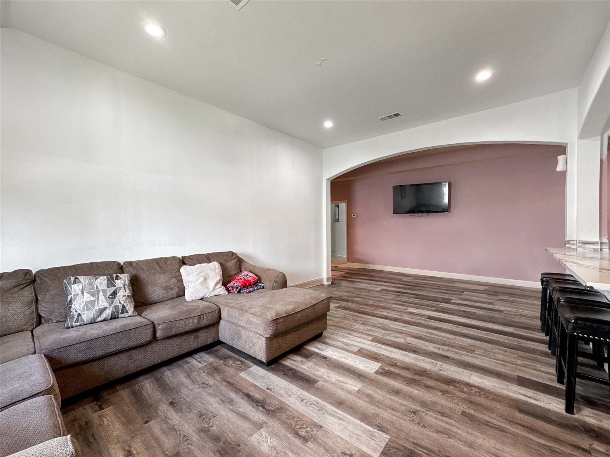 1060 County Road 5021 Cleveland, TX 77327 - Photo 10 of 34 a living room with furniture and a flat screen tv