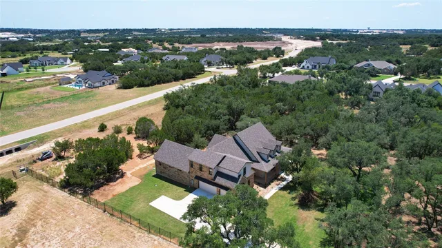 an aerial view of a house with a garden