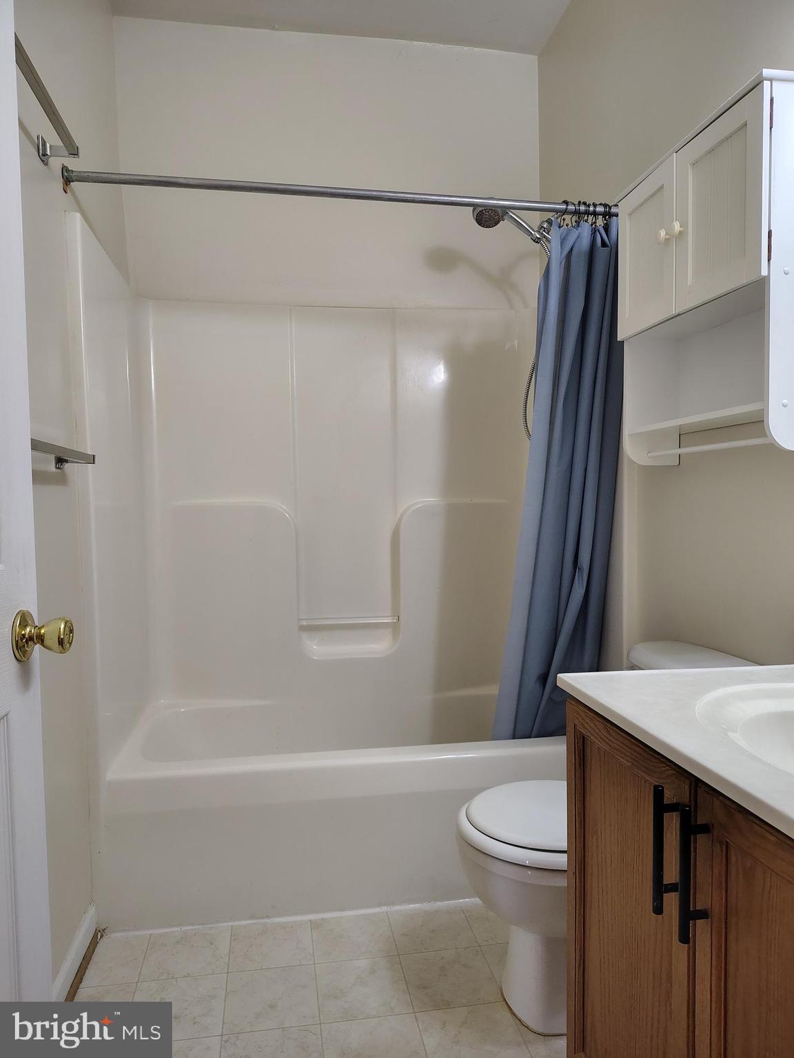 444 Delaware Road Frederick, MD 21701 - Photo 19 of 23 a bathroom with a granite countertop bathtub shower sink vanity and toilet