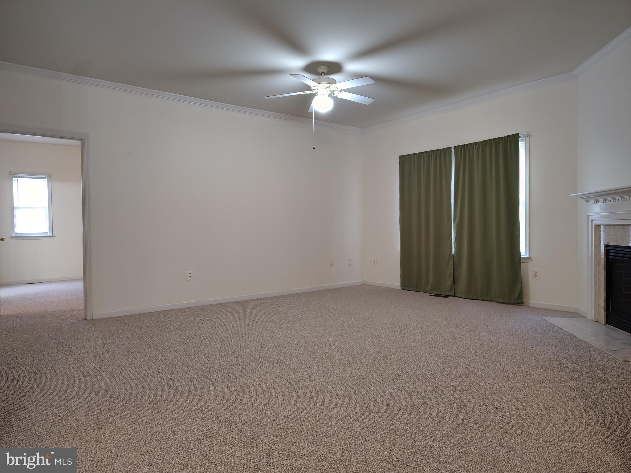 444 Delaware Road Frederick, MD 21701 - Photo 2 of 23 a view of an empty room with a chandelier fan