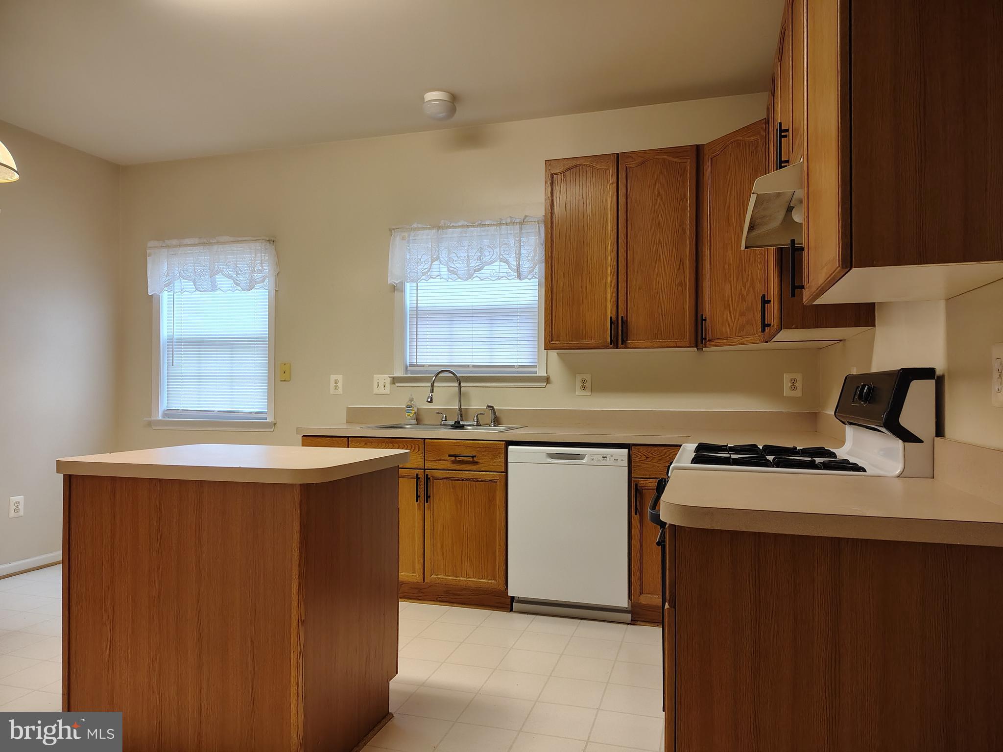 444 Delaware Road Frederick, MD 21701 - Photo 6 of 23 a kitchen with a sink stove and cabinets